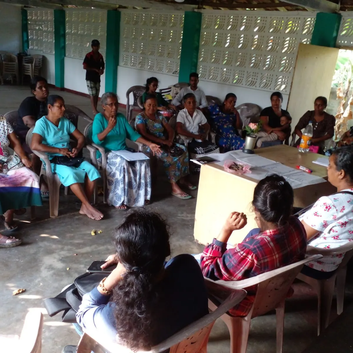 Women in a group discussion during the scoping study